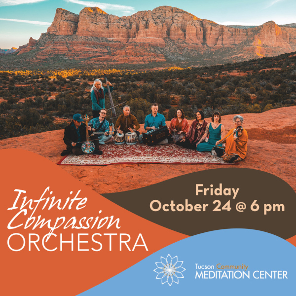 Orchestra Members seated in front of a mountain